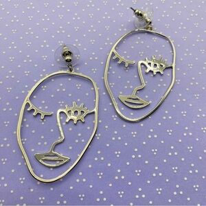 Abstract Face Cut Out Silver Tone Earrings